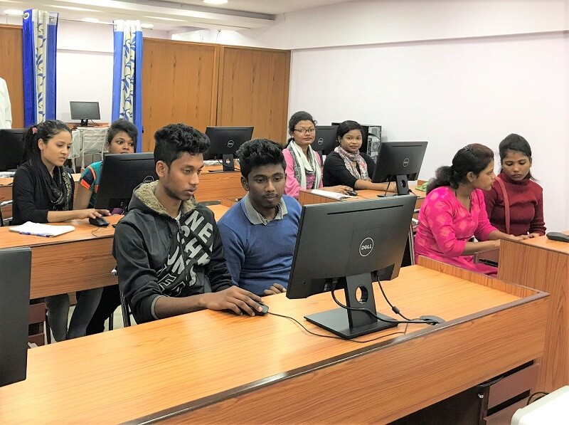 students in pairs in computer lab